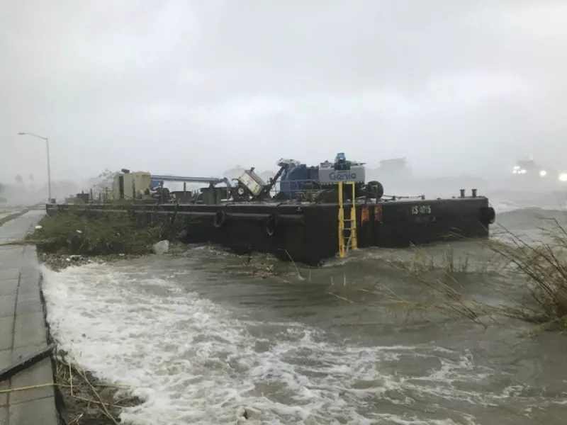 A barge runs aground along in Pensacola (Tony Giberson//Pensacola News Journal/AP)