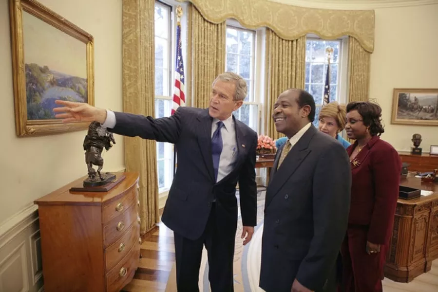 Paul Rusesabagina and his wife Tatiana meet George and Laura Bush at the Oval Office in 2005 (Eric Draper/The White House/AP)