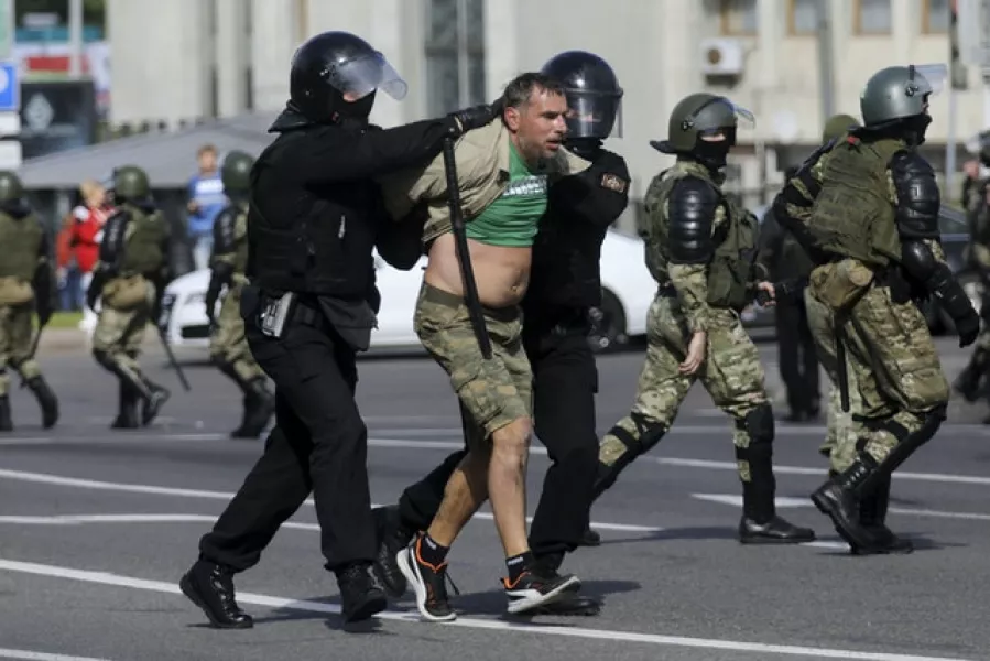 Riot police officers detain a protester during a Belarusian opposition supporters’ rally (AP Photo)