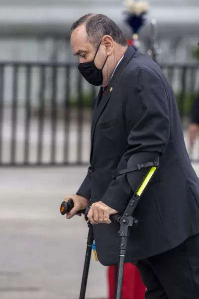 Guatemalan President Alejandro Giammattei wearing a protective face mask (Moises Castillo/AP)