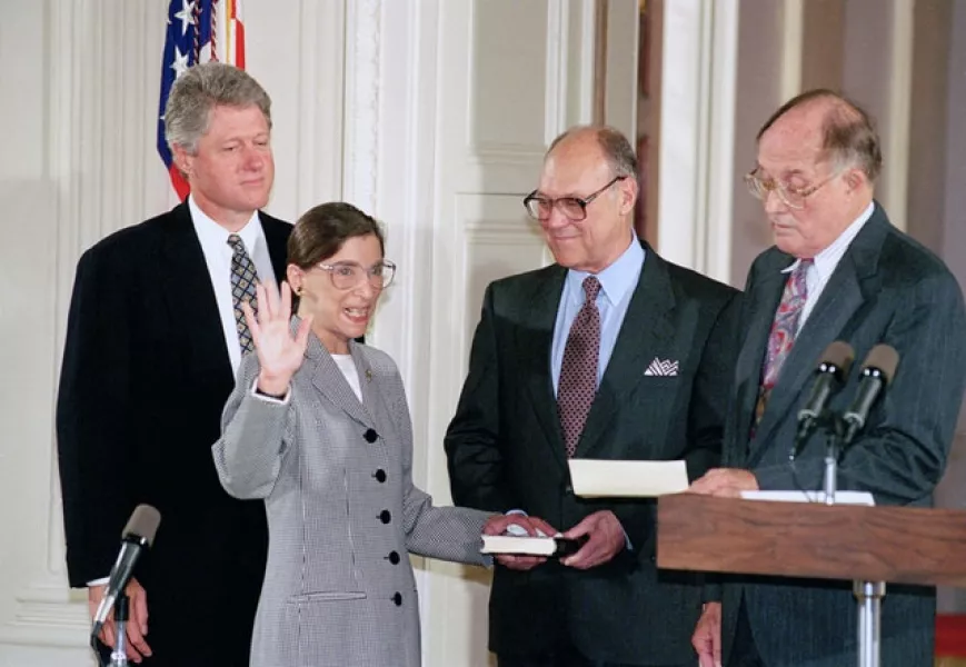 Ruth Bader Ginsburg takes the court oath from Chief Justice William Rehnquist, right, as President Bill Clinton (left) looks on, after her 1993 appointment (Marcy Nighswander/AP)