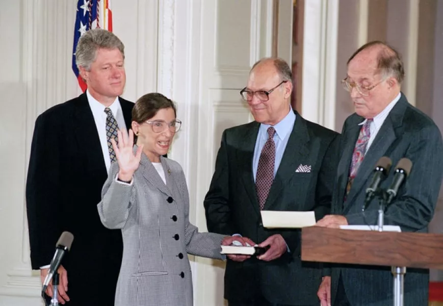 Ruth Bader Ginsburg takes the court oath from chief justice William Rehnquist, right, as then-president Bill Clinton (left) looks on, after her 1993 appointment (Marcy Nighswander/AP)