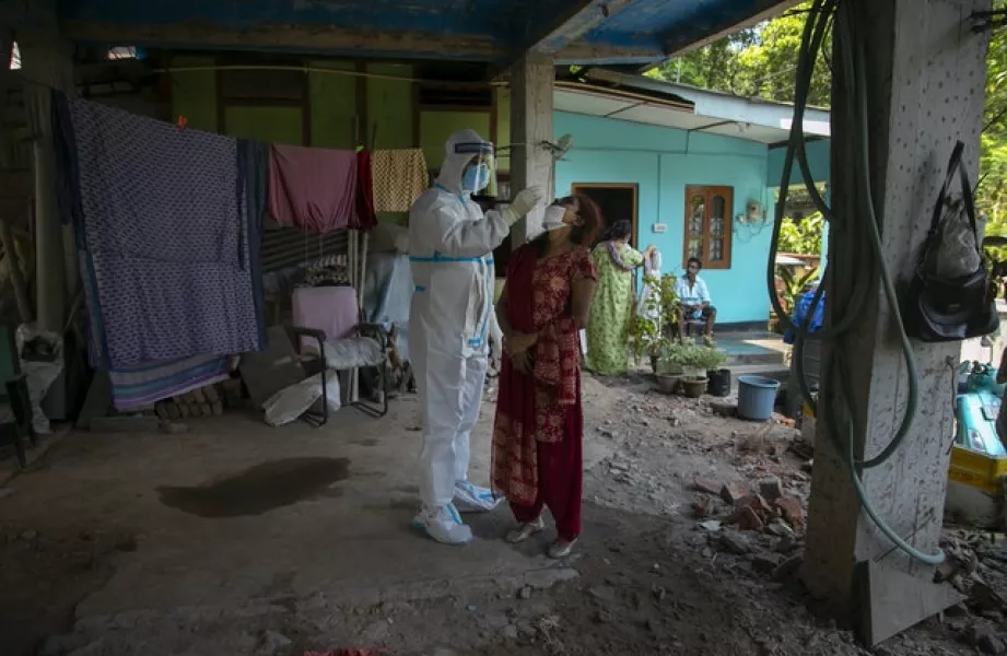 Covid testing during a door-to-door visit in Gauhati, India (Anupam Nath/AP)