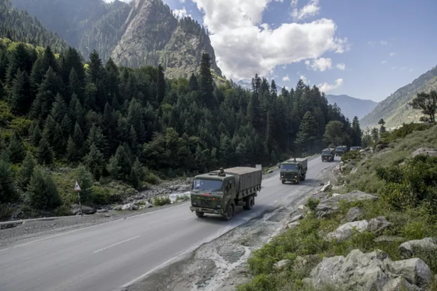 An Indian army convoy moves on the Srinagar- Ladakh road (Dar Yasin/AP)