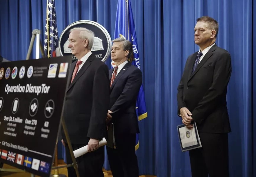 Deputy attorney general Jeffrey Rosen, announces a worldwide crackdown on opioid trafficking on the darknet with FBI director Christopher Wray and DEA acting administrator Timothy Shea (Olivier Douliery/Pool/AP)