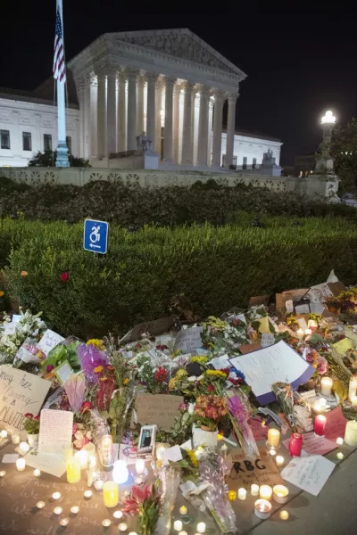 A shrine on the footpath outside the Supreme Court in Washington honours the late Ruth Bader Ginsburg (Cliff Owen/AP)