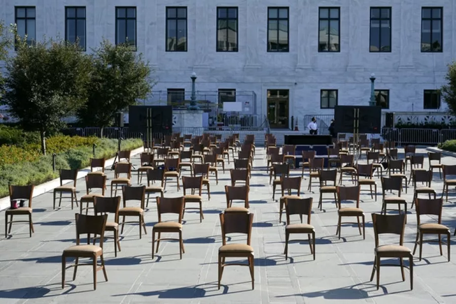 Chairs sit on a plaza outside the Supreme Court as preparations take place for a private ceremony and public viewing in remembrance of Ms Ginsburg (Patrick Semansky/AP)