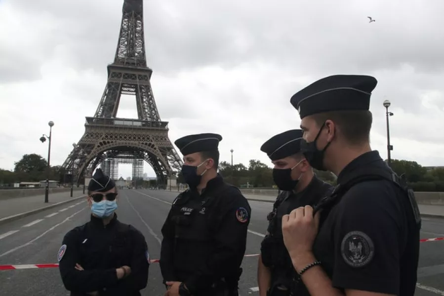French police officers secure the bridge leading to the Eiffel Tower (Michel Euler/AP)