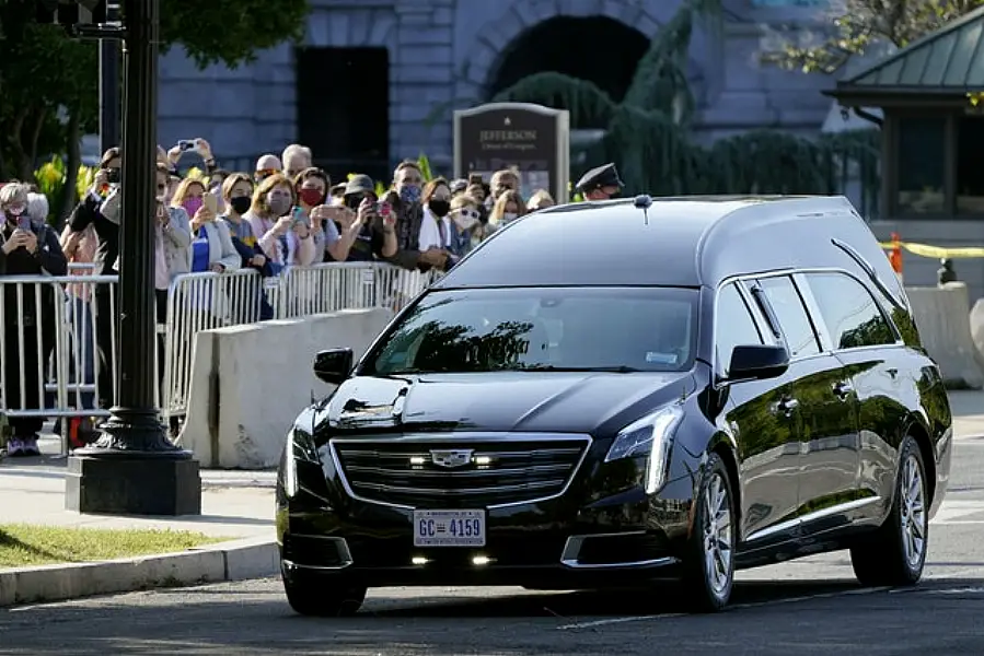 A hearse carrying the flag-draped casket of Justice Ruth Bader Ginsburg arrives at the Supreme Court in Washington (Patrick Semansky/AP)