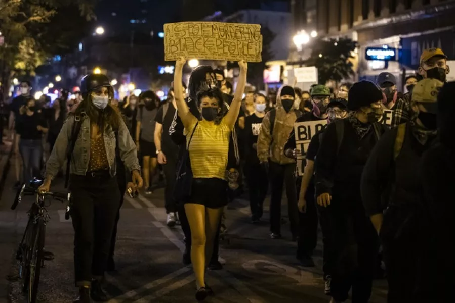 Protesters march through Chicago (Ashlee Rezin Garcia/Chicago Sun-Times/AP)