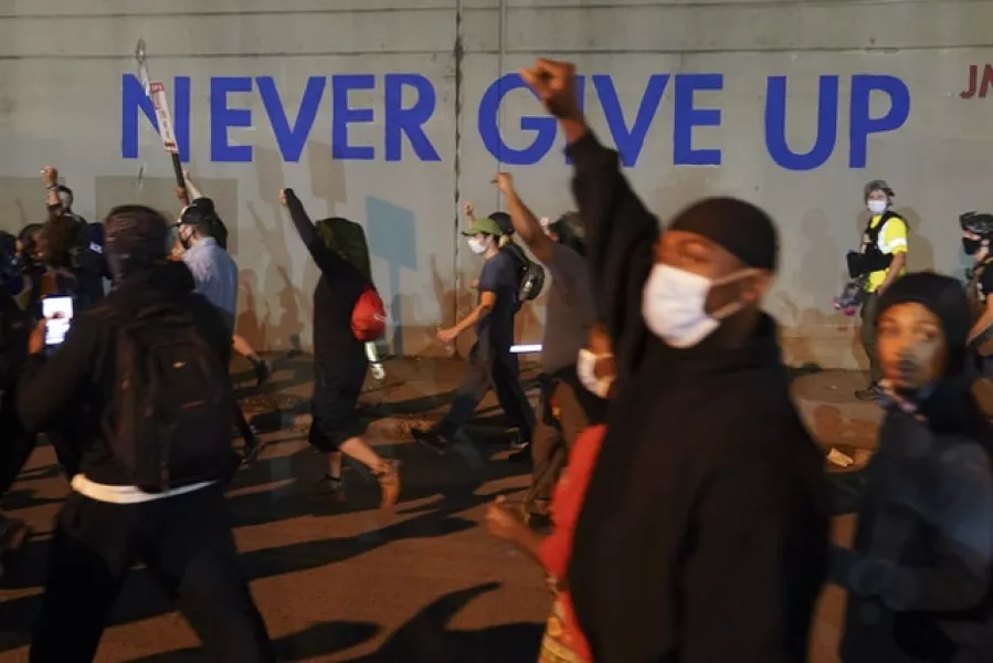 Protesters march through Louisville (John Minchillo/AP)