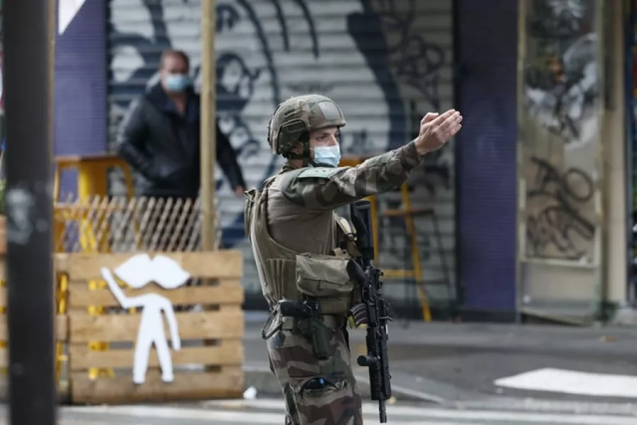 A soldier on patrol in Paris after the attack (Thibault Camus/AP)