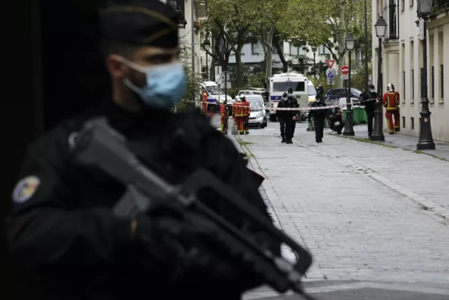 A French police officer guards a nearby street (Lewis Joly/AP)