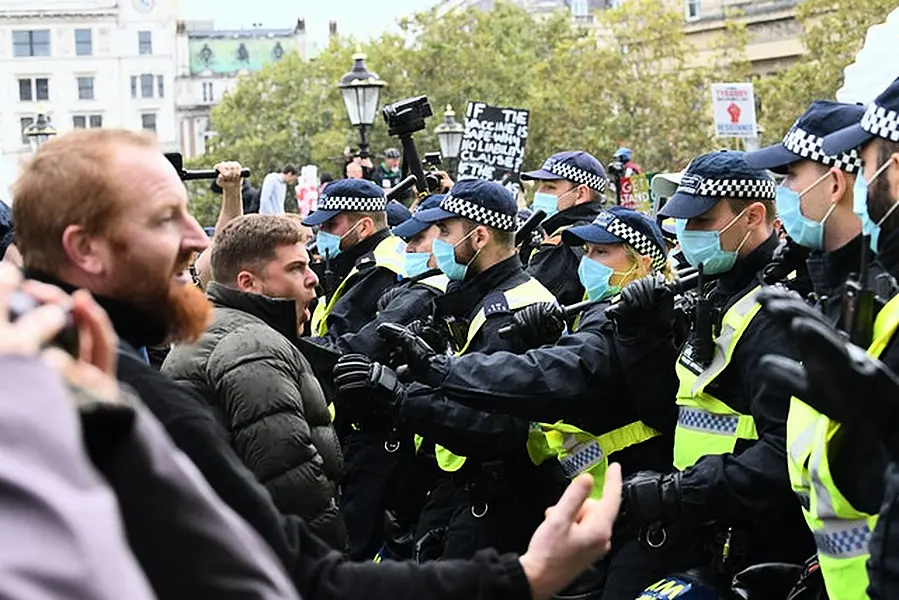 Protesters and police in Trafalgar Square (Stefan Rousseau/PA)