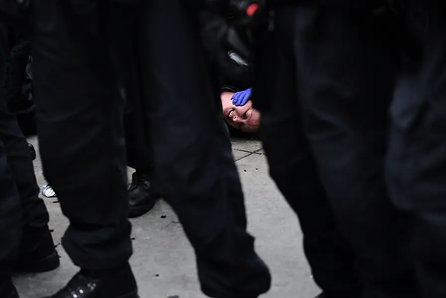 A protester on the ground in Trafalgar Square (Stefan Rousseau/PA)