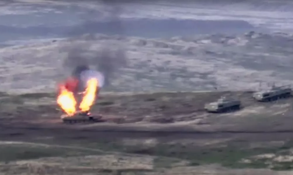 Armenian forces destroy an Azerbaijani tank (Armenian Defence Ministry via AP)