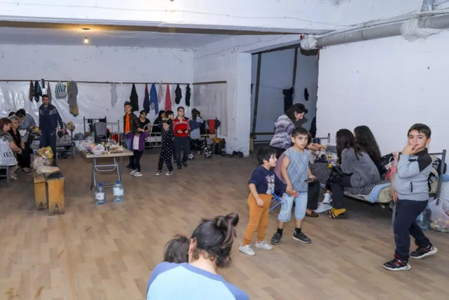 People gather in a bomb shelter to protect against shelling in Stepanakert (Edgar Kamalyan/Armenian Foreign Ministry via AP)