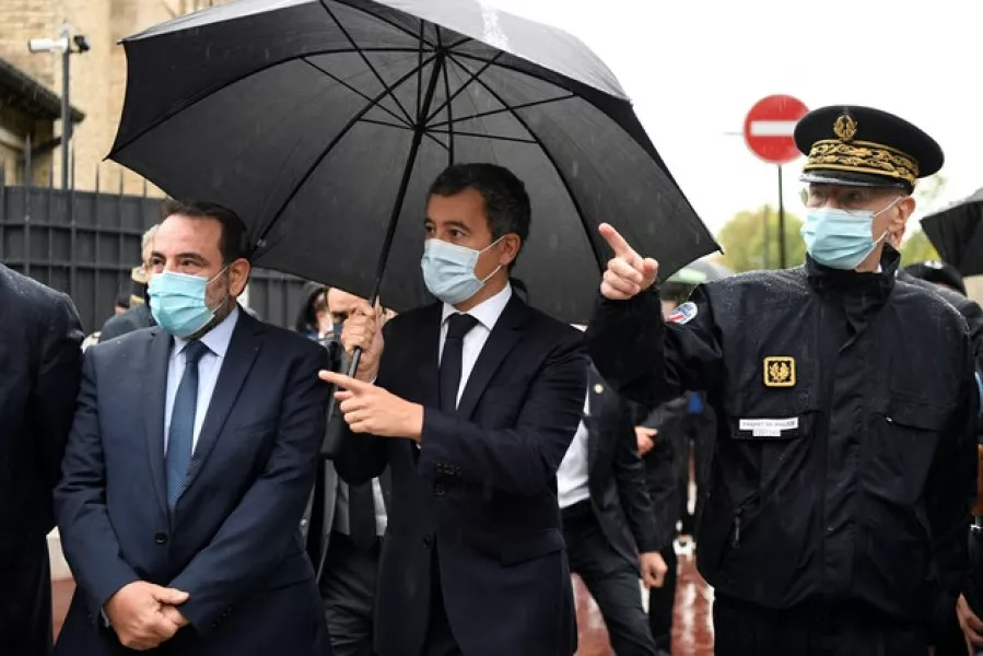 French interior minister Gerald Darmanin (centre), Joel Mergui, president of the Israelite Central Consistory of France (left), and Paris police prefect Didier Lallement, arrive for a visit at the synagogue of Boulogne-Billancourt, outside Paris (Bertrand Guay/Pool via AP)