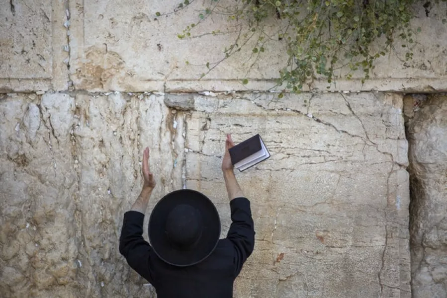An Ultra-Orthodox Jewish man prays at the Western Wall in Jerusalem’s old city (Ariel Schalit/AP)