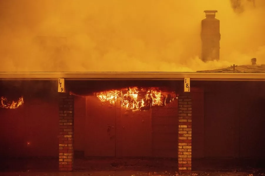 Flames consume a house in Oakmont (Noah Berger/AP)