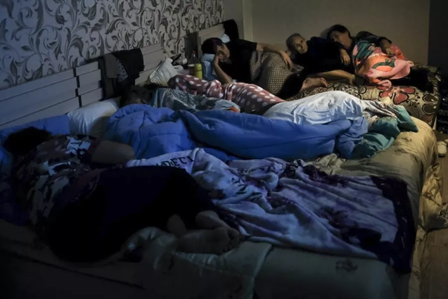 People gather in a bomb shelter to protect against the shelling in Stepanakert (Armenian Foreign Ministry via AP)