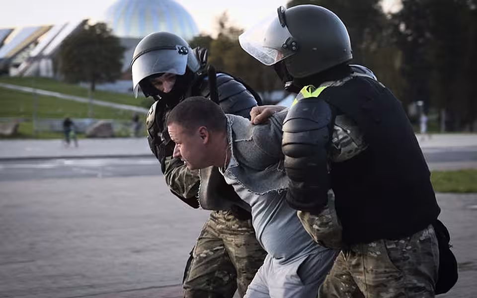 Riot police detain a protester during an opposition rally over Mr Lukashenko (TUT.by/AP)