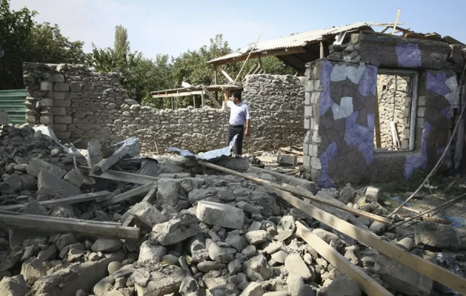 A building allegedly damaged by recent shelling during the fighting (AP/Aziz Karimov)