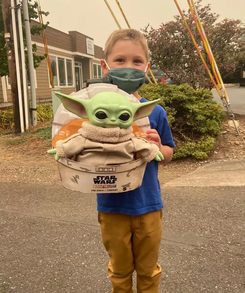 Five-year-old Carver with Baby Yoda in Scappoose, Oregon (Courtesy of Tyler Eubanks)