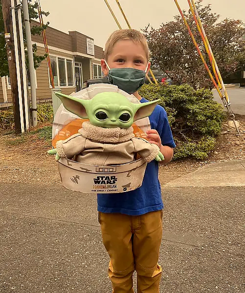 Five-year-old Carver with Baby Yoda in Scappoose, Oregon (Courtesy of Tyler Eubanks)