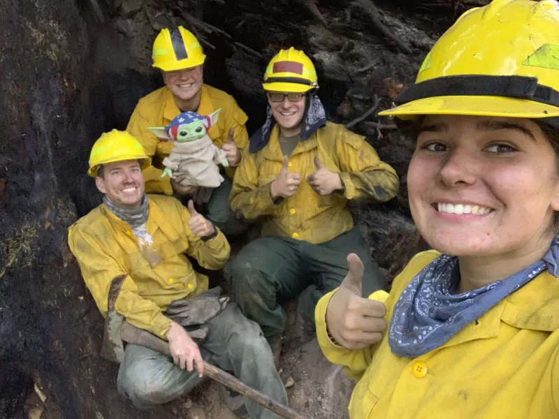 Lucas Galloway, Jaebyn Drake, Rhett Schieder and Audrey Wilcox pose for a selfie with Baby Yoda in Blue River, Oregon (Courtesy of Audrey Wilcox via AP)