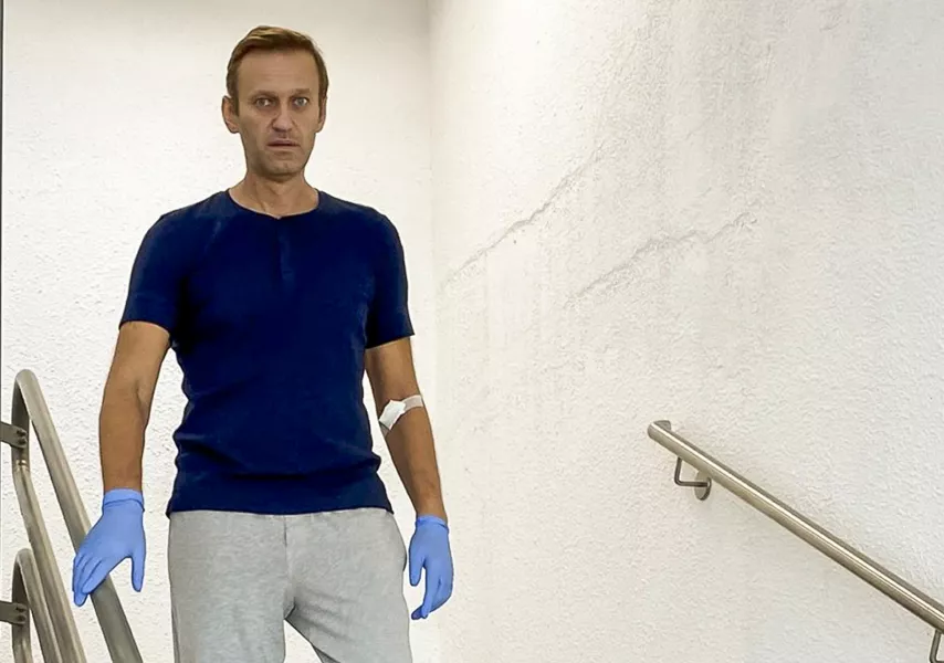 Russian opposition leader Alexei Navalny walks down stairs in a hospital in Berlin, Germany (Navalny Instagram via AP)