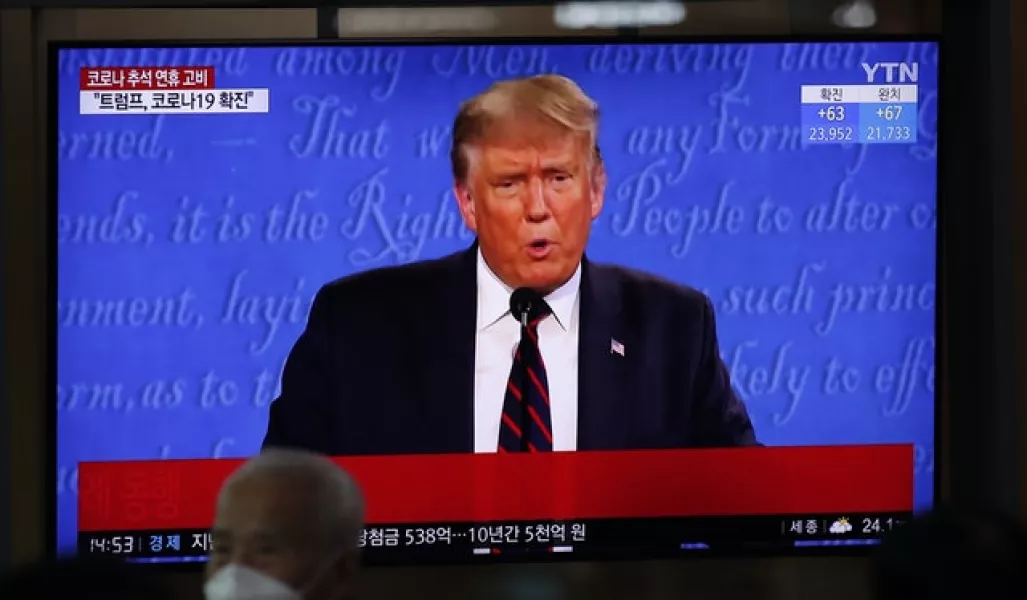A TV screen shows Mr Trump at Seoul Railway Station (AP)
