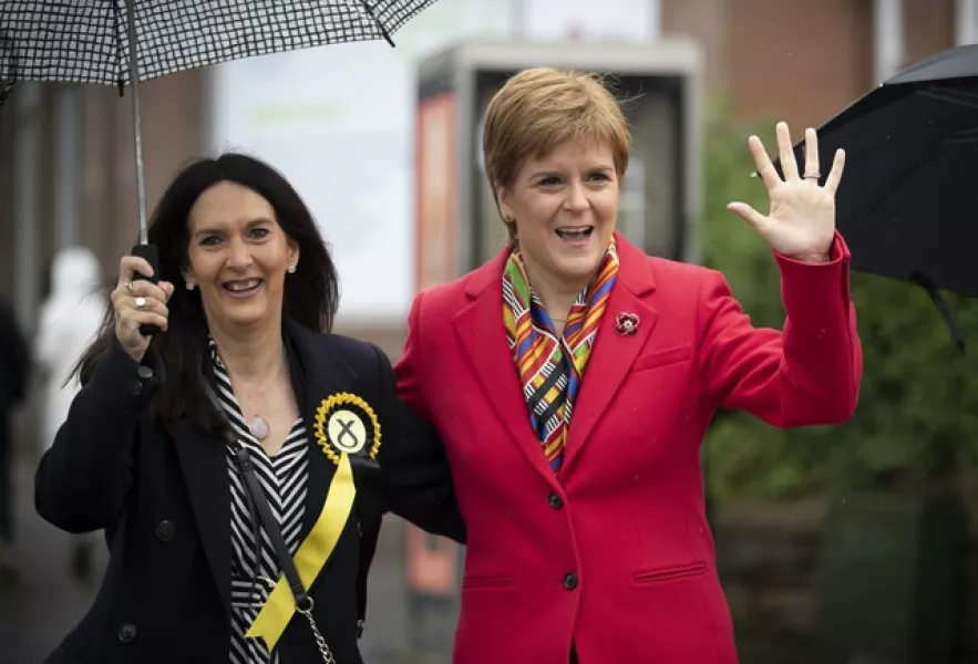 Margaret Ferrier, left, campaigning for last year’s general election alongside First Minister Nicola Sturgeon (PA)