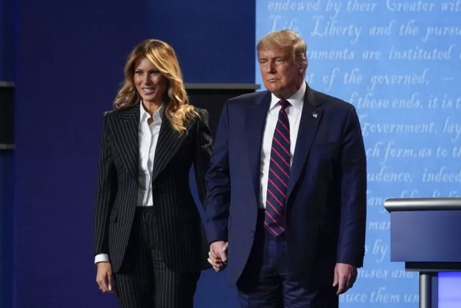 Donald and Melania Trump hold hands on stage after the first presidential debate (Julio Cortez/AP)