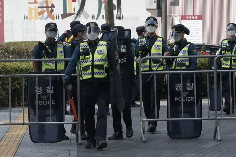 Police officers in Seoul, where outdoor rallies involving 10 people or more have been temporarily banned (Lee Jin-man/AP)
