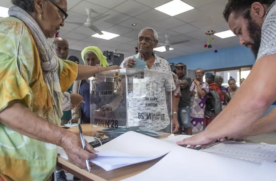 A man casts his vote in Noumea, New Caledonia (Mathurin Derel/AP)
