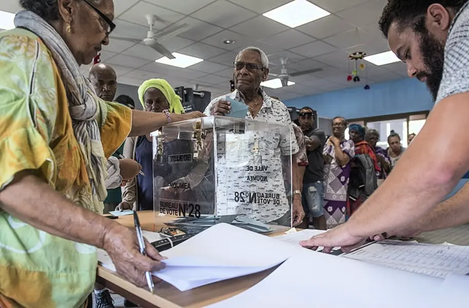 A man casts his vote in Noumea, New Caledonia (Mathurin Derel/AP)