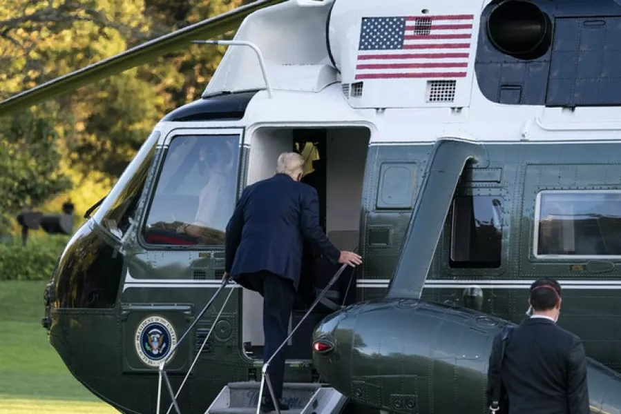 President Donald Trump boards Marine One as he leaves the White House to go to Walter Reed National Military Medical Centre (Alex Brandon/AP)