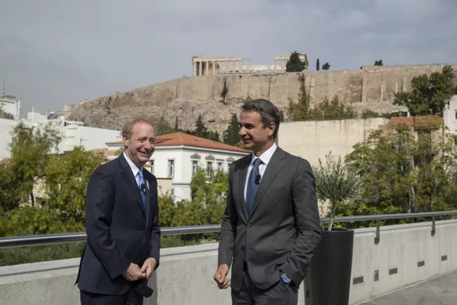 Microsoft President Brad Smith, left, speaks with Greek prime minister Kyriakos Mitsotakis during a ceremony held in the Acropolis Museum (Petros Giannakouris/AP)