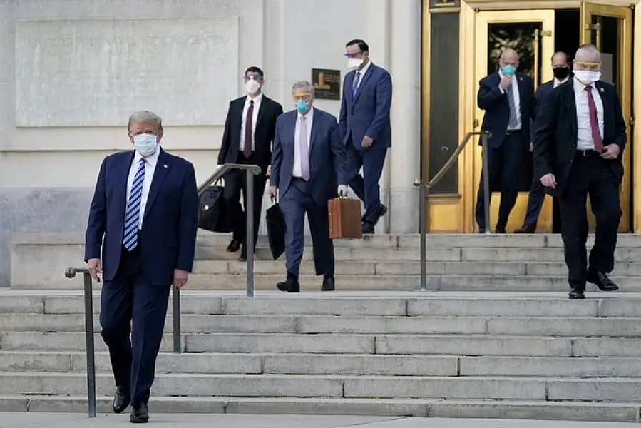 Donald Trump walks out of Walter Reed National Military Medical Centre (Evan Vucci/AP)