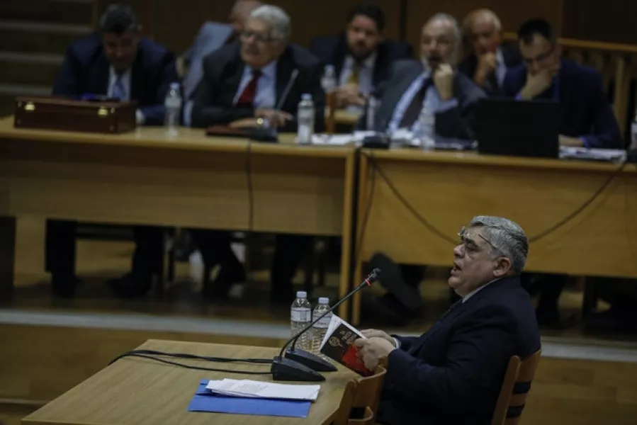 The head of Greece’s Golden Dawn party Nikos Michaloliakos testifies in the Court of Athens last year (Petros Giannakouris/AP)