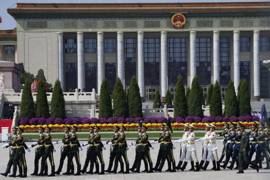 Chinese honour guard members march near the Great Hall of the People in the recent Martyr’s Day celebrations in Tiananmen Square. China’s territorial aggression in the Asian region has helped increased mistrust among people in several advanced democracies, according to the Per survey (Ng Han Guan/AP)