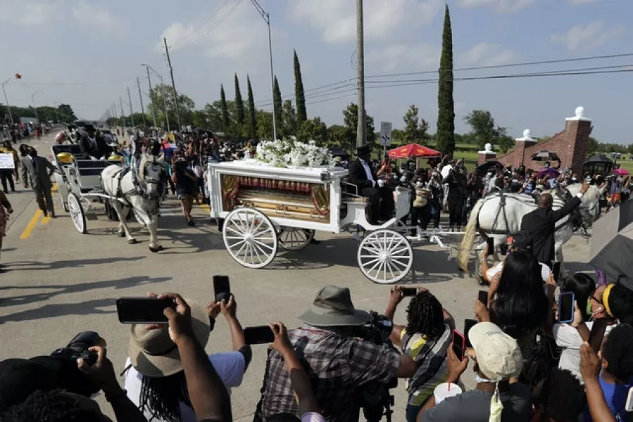 George Floyd’s funeral procession arrives at Houston Memorial Gardens cemetery, in Pearland, Texas (Eric Gay/AP)