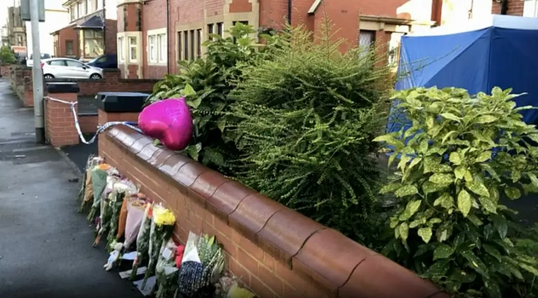 Tributes left at the scene where Dr Saman Mir Scharvi, 49, and daughter Vian Mangrio, 14, were found dead in their fire and smoke-damaged house (Kim Pilling/PA)