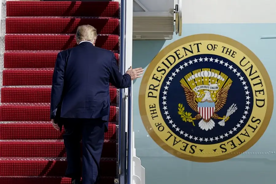 President Donald Trump boards Air Force One (Susan Walsh/AP)