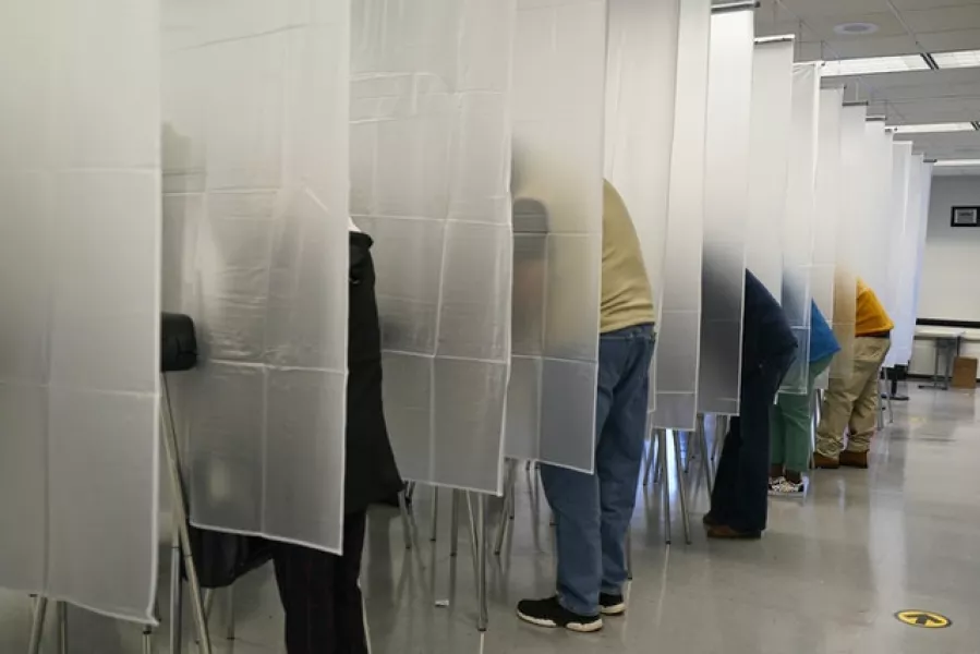 Voters fill out their ballot during early voting at the Cuyahoga County Board of Elections in Cleveland, Ohio (Tony Dejak/AP)