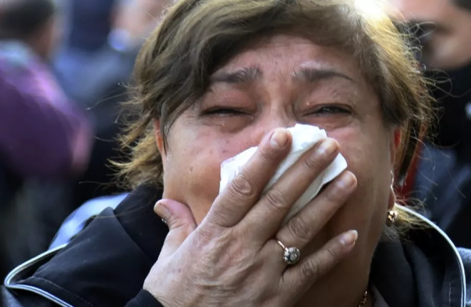 A woman cries while viewing damage after shelling by Armenian’s artillery (AP/Aziz Karimov)