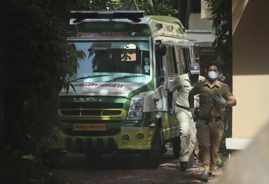 An ambulance carrying the body of Bollywood actor Sushant Singh Rajput (Rafiq Maqbool/AP)