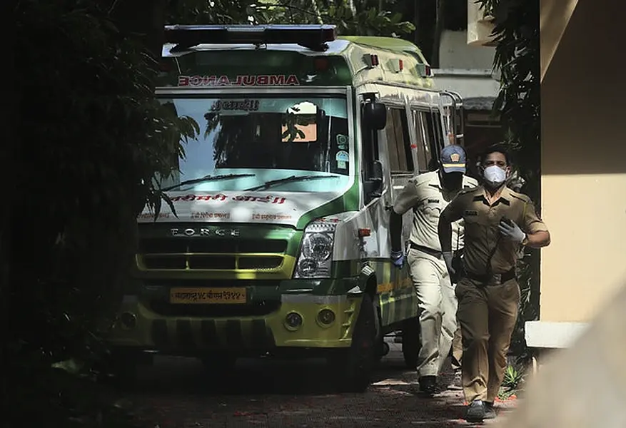 An ambulance carrying the body of Bollywood actor Sushant Singh Rajput (Rafiq Maqbool/AP)