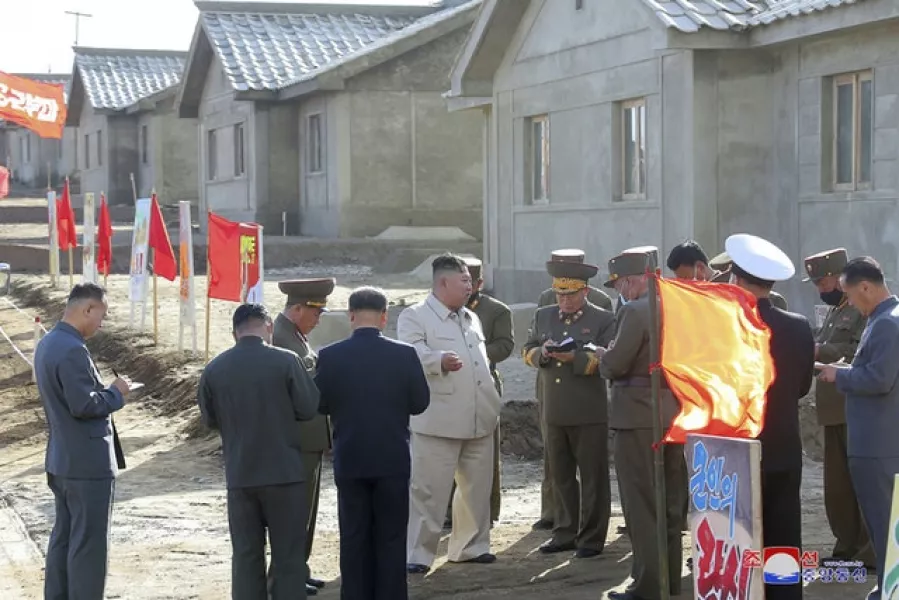 Mr Kim inspects recovery work in the rural town of Komdok (Korean Central News Agency/Korea News Service/AP)